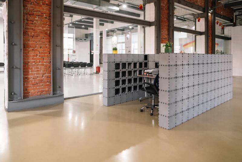 Gray Cubik booth standing in a bright loft