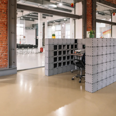 Gray Cubik office booth in a bright loft