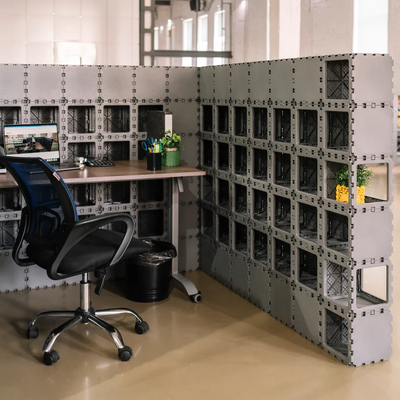 Cubik corner booth with desk and shelves