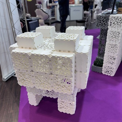 Large tooth model on a display at a dental expo