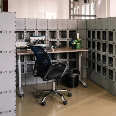 Gray Cubik corner booth with a desk, chair and open shelf compartments
